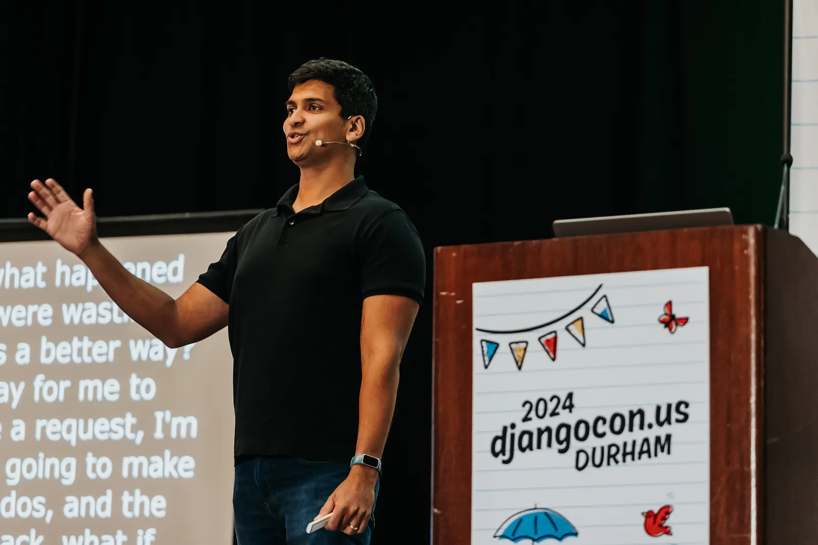 Avindra Fernando speaking on stage at DjangoCon US 2024 in Durham