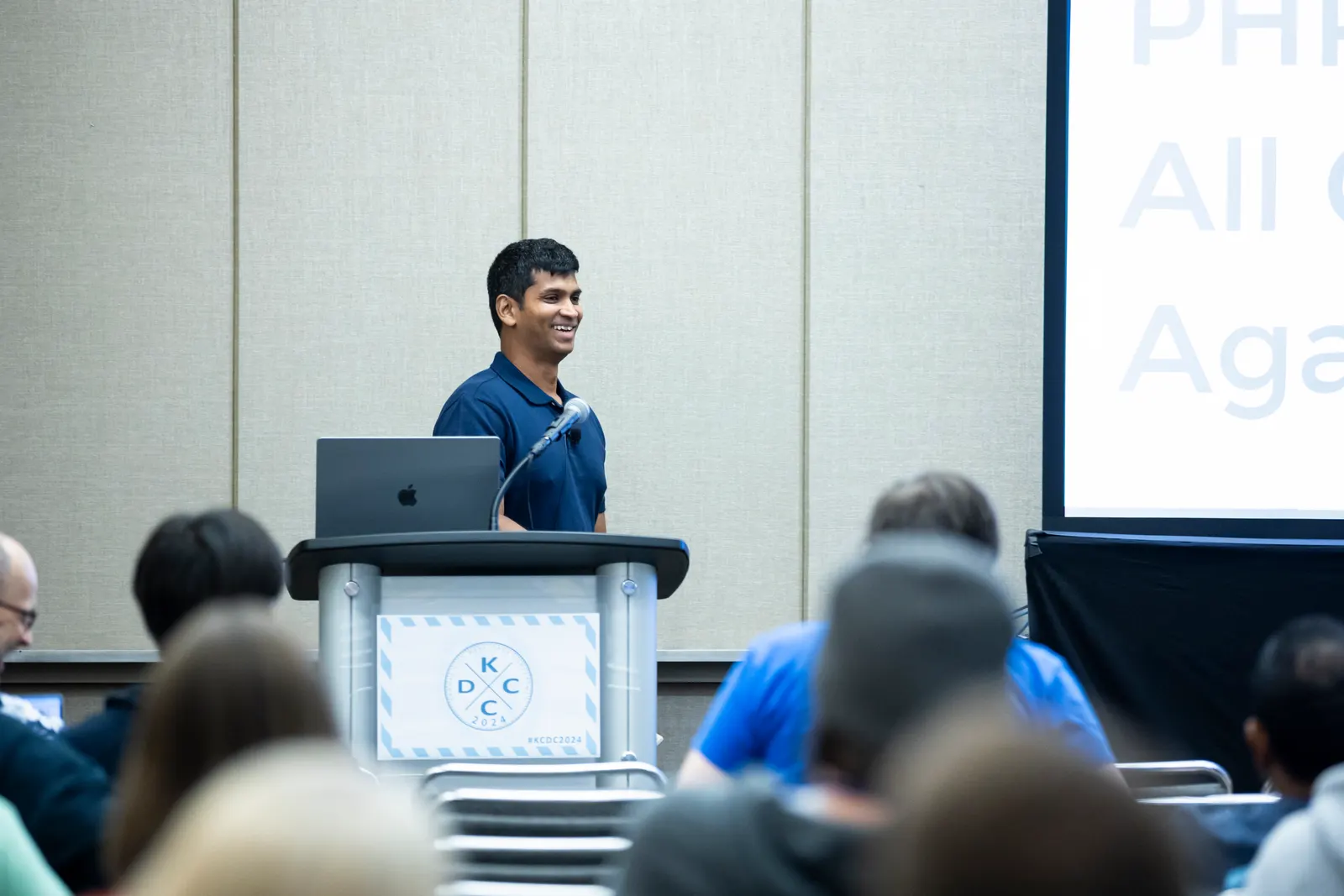 Avindra Fernando presenting at the KCDC 2024 podium